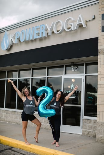 Kelsey and her partner meghan in front of KPower Yoga