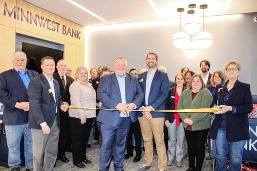 Grand opening ribbon cutting with Minnwest Bank team and guests